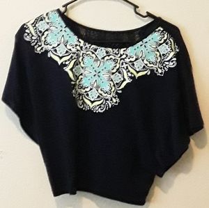 Blue shirt with designs